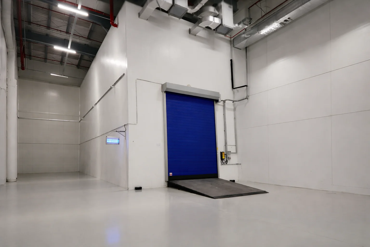 Exterior view of a walk-in chiller room projects installation with insulated panels and loading access in a Dubai industrial facility