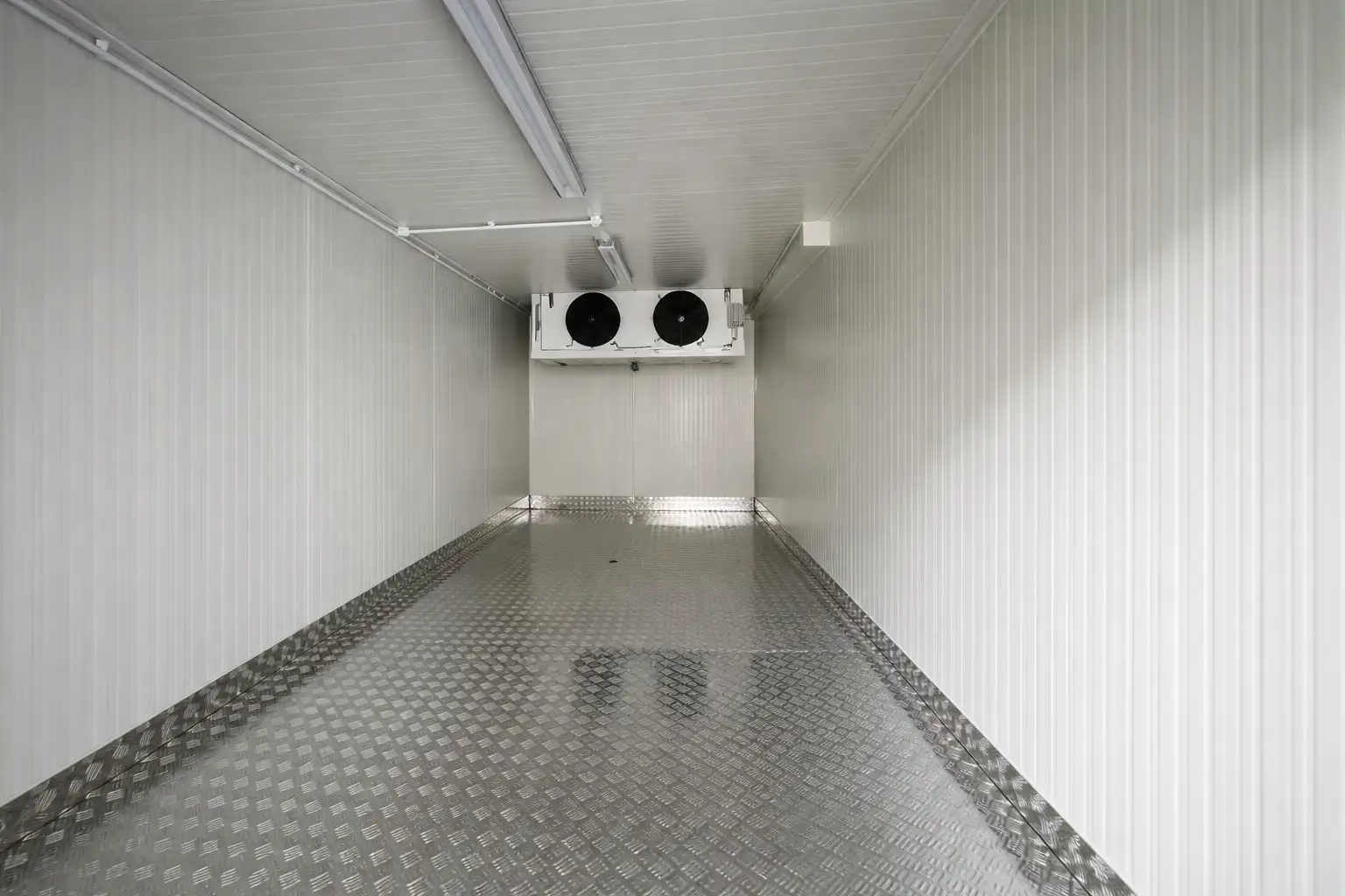 Chiller room interior showing precise panel installation, insulated walls and metal flooring finish in a Dubai project