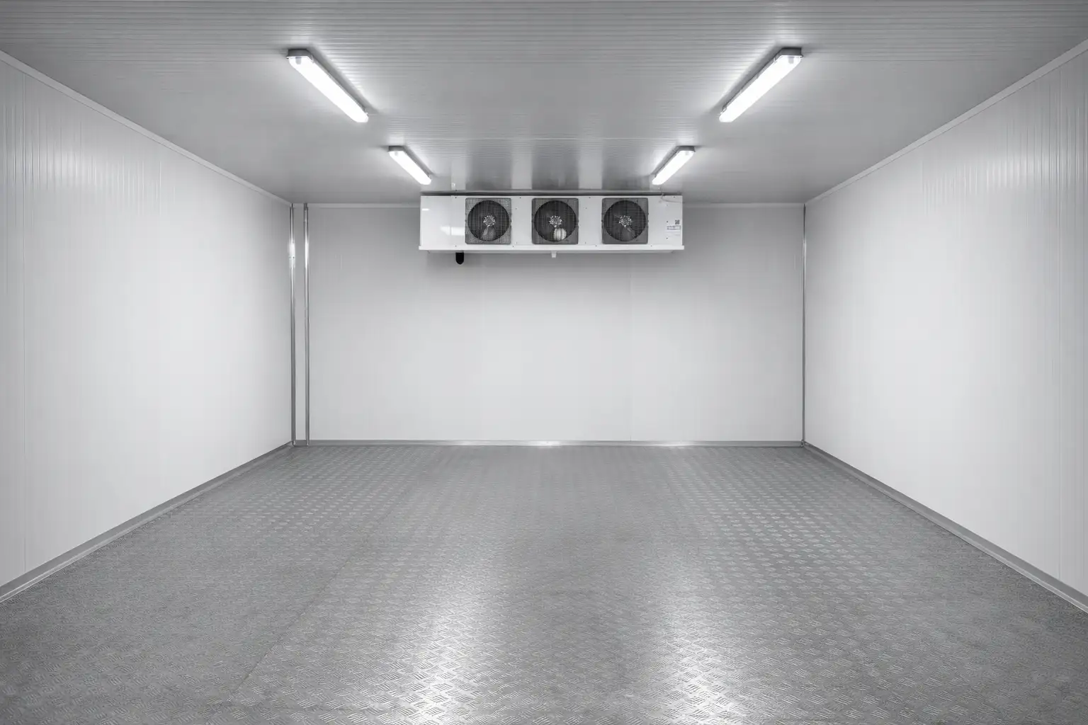 Clean chiller room interior with cooling unit, insulated panels and uniform lighting in a Dubai installation